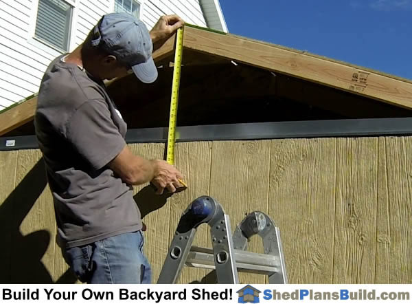 Installing siding on the shed walls